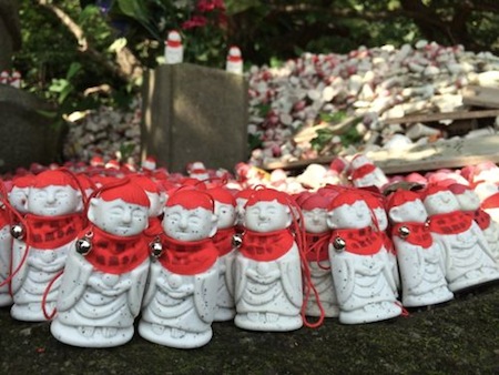 Close up of Red Dolls at Japanese Shrine